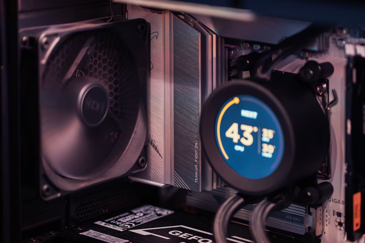 Services Close-up of a gaming PC build showcasing GPU, fan, and liquid cooling system.