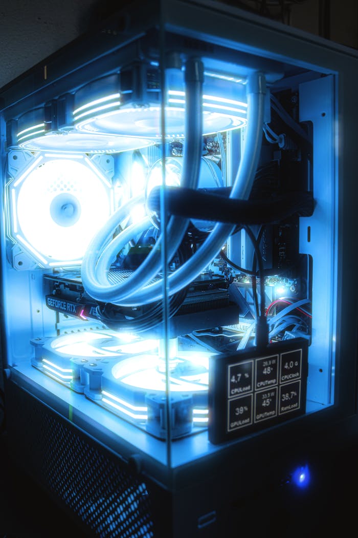 The Art of Drawing Readers In: Your attractive post title goes here High-performance gaming PC setup featuring blue LED lighting and advanced cooling system.
